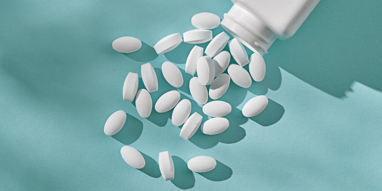 white pills on blue background